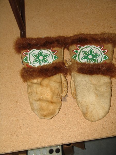 Athabascan Mittens: Ca. 1950, Athabascan moosehide mittens with beaded rosettes and beaver fur. Very good condition. Mens Medium