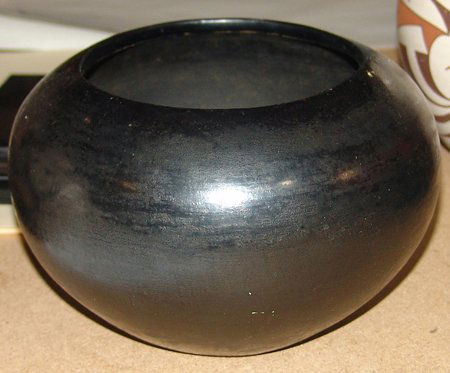 Pottery Bowl: Old San Ildefonso(?) pottery bowl, signed Maria. Very good condition. 5" x 8"