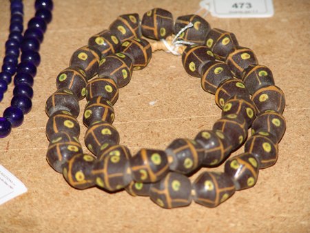 Antique Tradebeads: Strand of odd shaped glass tradebeads. 26"