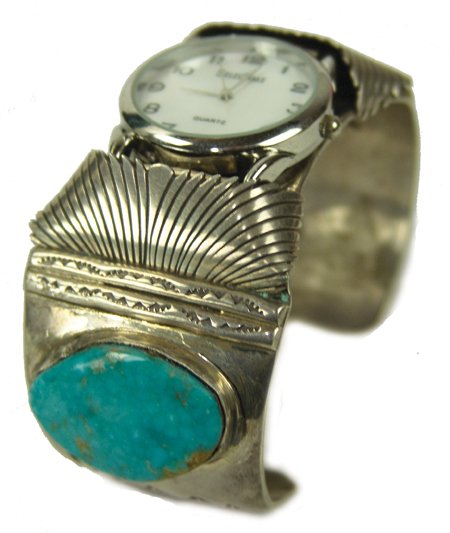 Navajo Watch Bracelet: Ca. 1970s, Expertly crafted, wide all-silver man's cuff bracelet with fine stamped details and two large turquoise stones, signed "JJ." Very good condition. 6-1/4" + 1-1/4" x 1-1/2"
