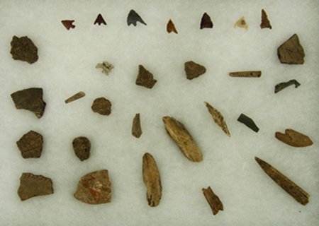 Artifact Frame: Various, Framed collection of Eskimo bone artifacts, pottery shards, and bird points. Various conditions. Various Sizes