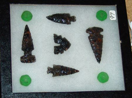 Point Collection: Framed collection of four mahogany obsidian points, modern. Good condition. Largest 1-3/4" x 1"
