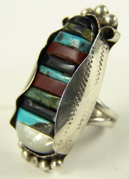 Navajo/Zuni Inlay Ring: Ca. 1980s, Unique original design all-silver ring done in a corn motif with carved raised inlaid stones. Very good condition. 11