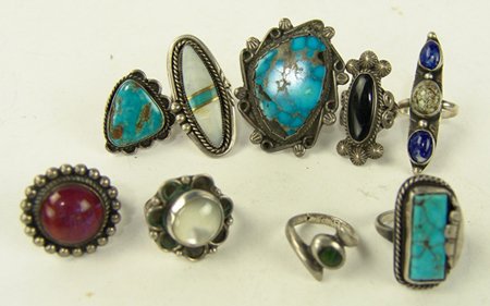 9 Navajo/Zuni Ring Collection: Ca. 1970s - 1980s, Collection of nine Navajo and Zuni rings with turquoise, mother of pearl, lapis, jet, and one opaline. All in good usable condition. Sizes 6 - 11-1/2