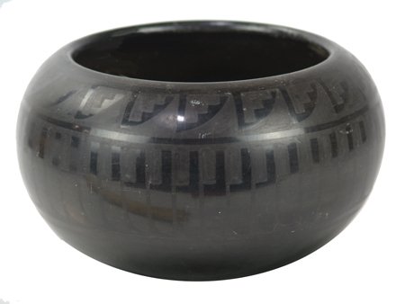 San Ildefonso Pottery Bowl - Blue Corn: Ca. 1970s, Classic rounded black-on-black bowl with feather pattern design. Sturdy and intact, but has some scratches and signs of rubbing. 5" x 7-3/4"