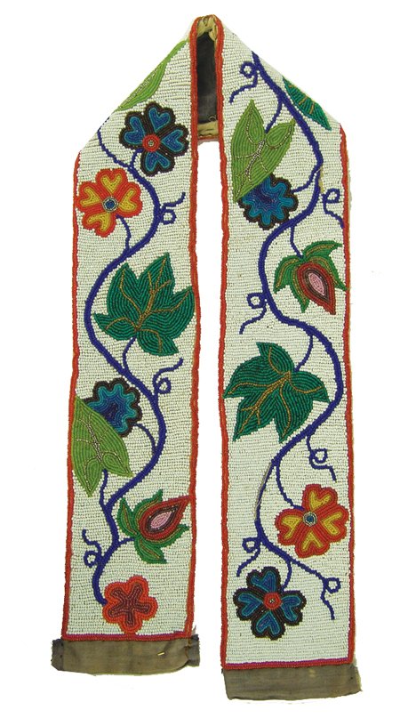 Chippewa/Cree Beaded Belt: Early 1900s, Traditional fully beaded belt with flowing floral motif on a white field. Very good condition, some minor bead loss and edge wear.* 35-1/4" x 3-1/2" *This piece is from the collection of 