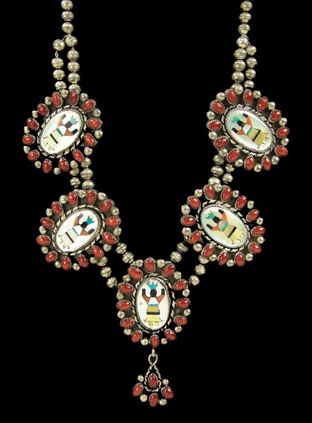 Navajo Necklace - Eula Mae Begay: Ca. 1970s, Very popular dancer inlay medallion necklace set in silver and outlined with coral stones, hallmarked EB. Very good condition. 35" long, pendant 3-1/4" x 1-1/2"