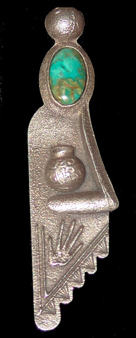 Santo Domingo Jewelry - Anthony Lovato: Ca. 1980s, Fantastic original design tufa cast all-silver vertical pin/pendant showing a stylized pot carrier with other unique symbols and a beautiful green turquoise stone. Very good condition. 4-1/