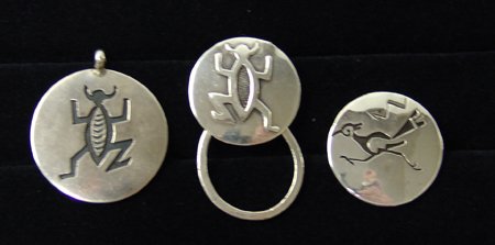 3 Jewelry Pieces - Joe Quintana: Ca. 1980s, Collection includes a small overlay pin with a roadrunner design on it, an overlay pendant with a lizard shape, and a matching key ring done in reverse by expert silversmith Joseph H. Quint