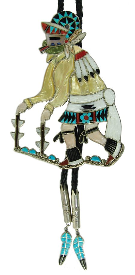 Zuni Inlay Bolo Tie - N & T Leekela: Ca. 1980s, Large and beautiful channel inlay sheep dancer bolo tie with carved stones and custom inlaid feather tips. Very good condition. "N & T" is the husband/wife team of Nicholas and Theresa. 40"