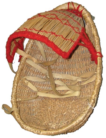 Atsugewi Basketry Cradleboard: Ca. 1950, Rare and beautiful woven willow newborn carrier with red yarned decorations. Very good condition. This basket was featured on page 50 of Brian Bibby's book "Precious Cargo." Originally from 