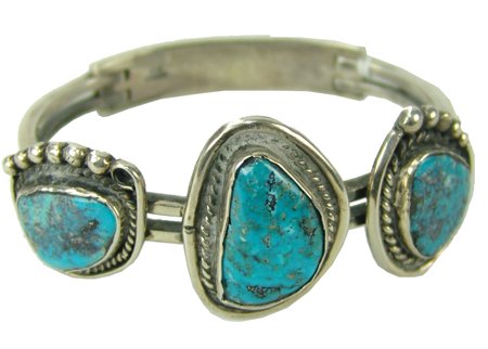 Navajo Bracelet: Late 1900s, Hand wrought heavier gauge all-silver bracelet with three turquoise stones and unique clasp on back. Good condition. 7" x 1-1/4"