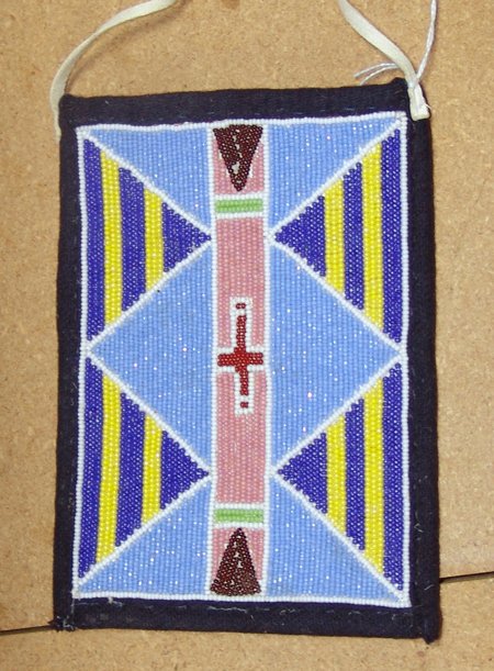 Crow Beaded Pouch: Late 1900s, Classic flat beaded pouch with tradecloth body and buckskin handles. Very good condition. 7" x 5"