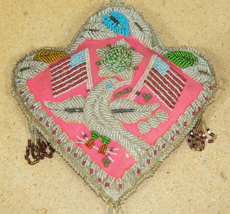 Iroquois Beaded Whimsey: Early 1900s, Classic stuffed cushion done in raised "Niagara style" beading with rare eagle and American flag design. Very good condition, a few missing beads. 12" x 12"