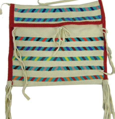 Crow Beaded Case: Ca. 1980s, A smaller handcrafted white buckskin version of the "possible bag" with flap top and rows of lazy stitch beaded designs (some cut beads). Very good condition. 10-1/4" x 12" + handle & fring