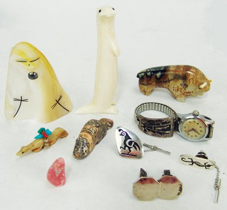 Box Lot of Indian Material: Various, Includes ivory and shell carvings, stone fetishes, a Hopi overlay watchband, two tie tacs, etc. All in various conditions. Largest 3-3/4" x 1-5/8" x 1"