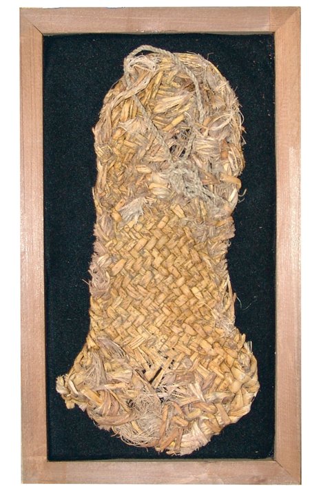 Anasazi Sandal: Prehistoric, Rare woven heavy 10-1/2" long twill sandal found near Blanding, Utah. In 13" x 7-1/2" frame