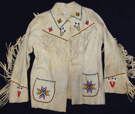 Plateau Buckskin Jacket: Mid 1900s, Beautiful handcrafted tanned buckskin jacket with stars, chevrons, and other interesting symbols beaded on the front and back. Very good condition. Men's Large