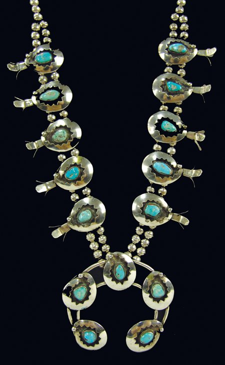 Navajo Necklace: Ca. 1970s, Classic shadow box design turquoise and silver squash blossom necklace with 15 stones. Very good condition. 28" long, naja 3" x 3-1/8"