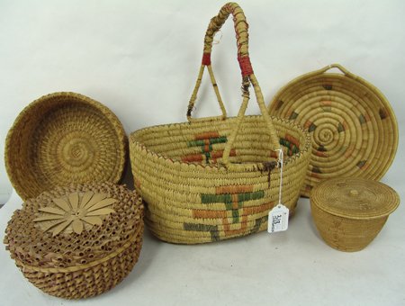 Box Lot of Baskets: Varoius Ages, Includes a nice Eskimo tray, a Cherokee pine needle bowl, a lidded fancy weave Cherokee basket, a large Chehalis carrying basket (broken handle), and a fine weave lidded non-Indian baske