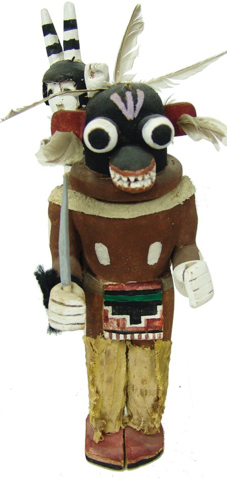 Hopi Kachina Carving: Ca. 1980s, Traditional hand carved and painted cottonwood root "Awatovi Soyok" (Black Ogre) doll with a Koshare/Hano clown on its back. Very good condition. From a private Albuquerque collection from 
