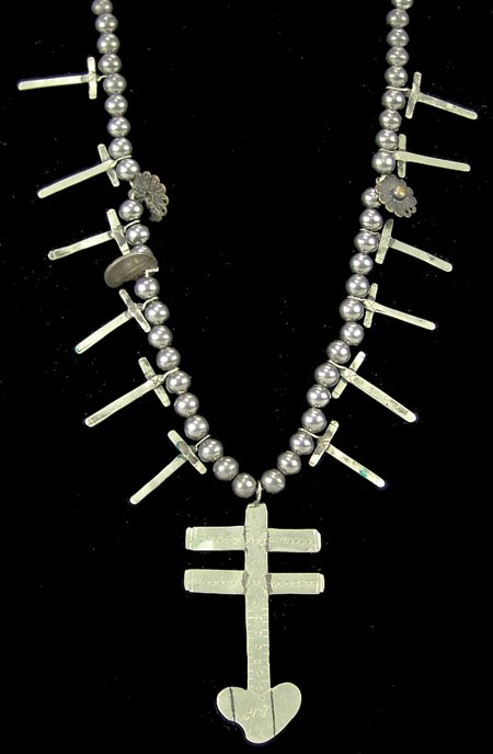 Pueblo Necklace: Mid 1900s, Vintage hand wrought silver and German silver cross necklace with dime and rosette attachments. Very good condition. 28" long, naja 3-1/8" x 1-5/8"
