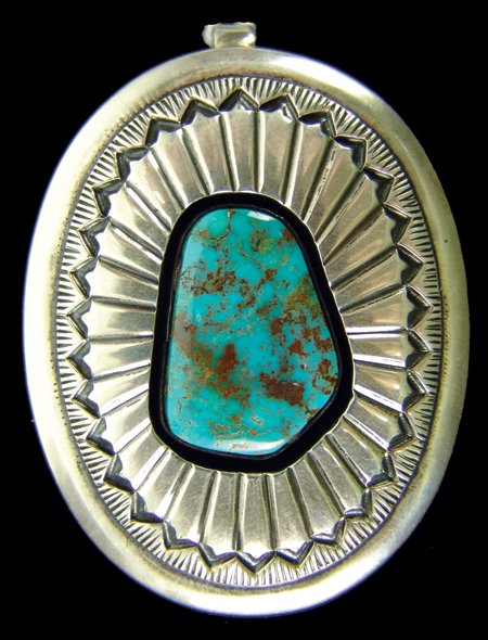 Navajo Pendant - Ernest Bilagody: Late 1900s, Fine hand stamped shadow box design all-silver pendant with a single high quality Cerillos turquoise stone. Excellent condition. 2-1/4" x 1-5/8"