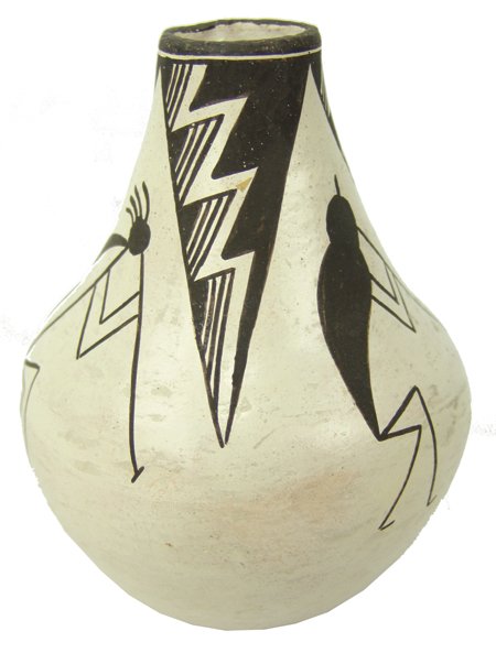Acoma Pottery Jar - Lucy M. Lewis: Ca. 1960s-1970s, Vintage black-on-white vase with long neck and flute playing Kokopelli figures. Very good condition, a few minor scuffs. 5-1/2" x 4-1/2"