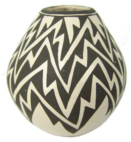 Acoma Pottery Jar - Lucy M. Lewis: Ca. 1970s, Classic shape black-on-white seed jar with popular lightning design. Very good used condition. 4-1/4" x 3-3/4"