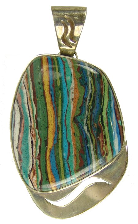 Mexican Pendant: Late 1900s, Fine sterling pendant with cut-out and colorful rainbow calisilica stone. Very good condition, marked "DS, .925." 2-1/2"