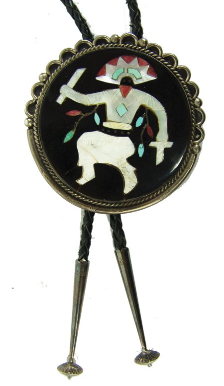 Zuni Inlay Bolo Tie - Elliot Qualo: Ca. 1970s, Vintage circular silver bolo tie with devil dancer figure done in fine mosaic inlay on a large shell or jet disc. Very good condition, a few minor cracks. From a private New Mexico collecti