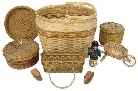 Basketry Group: Mid 1900s, Includes nice examples of Winnebago, Cherokee, and other plaited Woodlands baskets, most from split ash. Good to very good condition. 10-1/4" x 13" x 11-1/2" + handle