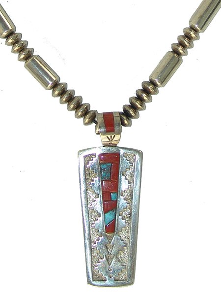 Navajo Necklace - Mike Perry: Late 1900s, Very fine contemporary all-silver pendant necklace with raised mosaic inlay pendant and bail, overlaid on a textured field. All strung on exceptional hand wrought round and barrel beads. V