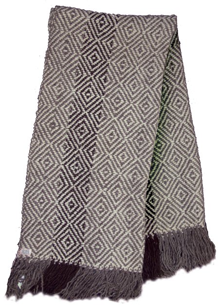 Lummi Wool Blanket - Fran James (1924-2013): Ca. 1989, Traditional hand woven all-wool blanket/shawl made with hand sheared, hand carded, and hand spun local wools. Very good condition. 43" x 88" + fringe