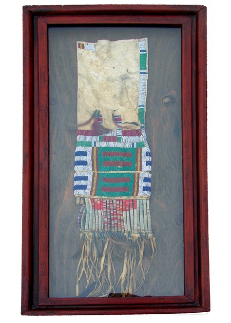 Cheyenne Beaded Pipe Bag: Early 1900s, Vintage double-sided tanned hide beaded pipe bag with quill wrapped fringe and tin cones. Nice example, some native repair. Framed (31" x 14") and ready to mount on your wall! 26" x 6" +