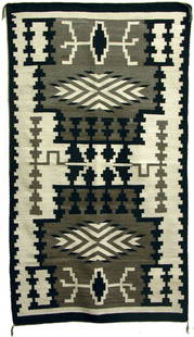 Navajo Weaving: Circa 1950's Beautiful, all homespun, natural wood storm pattern rug with water bugs, by Mary Spencer. 8'2" x 4'7"