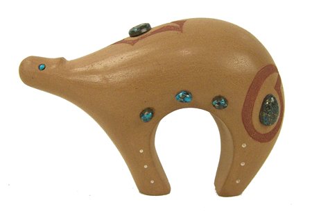 Santa Clara Pottery Bear - Art "Haungooah" Cody: Mid 1900s, Exquisite handcrafted pottery bear done with sgraffito designs and set with beautiful Bisbee turquoise stones. Very good condition, shows some handling. (Cody was actually Kiowa [1943-1985]