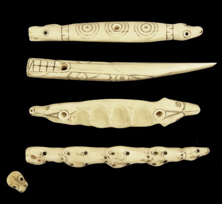 4 Eskimo Carved Items: Various Ages, All hand carved with scrimshaw designs including a two-headed pull handle, a simple awl, a two-headed tool box handle with finger grooves, and a Nunivak bear handle with a small pendant