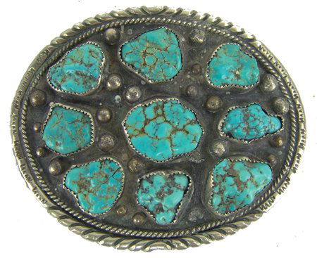 Navajo Belt Buckle - David Johnson: Ca. 1970s, Heavier gauge all-silver oval buckle with nine matching Royston/Godber turquoise nugget stone. Good used condition. 3-1/8" x 3-7/8"
