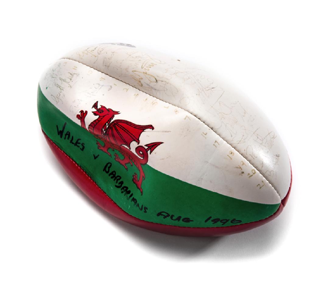 Wales v Barbarians 1996 signed rugby ball, signed by: Wales v Barbarians 1996 signed rugby ball, signed by both teams, Ieuan Evans, Nigel Davies, Gareth Thomas, Neil Jenkins, Rob Howley, John Davies, Jonathan Humphreys Williams et al, Aaron Pene, Stephan