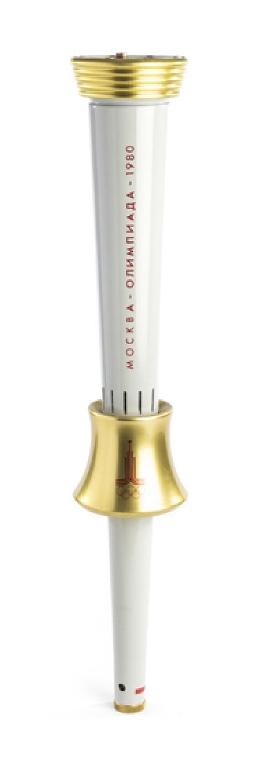 Moscow 1980 Olympic Games bearer's torch, designed by: Moscow 1980 Olympic Games bearer's torch, designed by Boris Tuchin, aluminum alloy, grey and gold, Moscow Games logo and legend in red, 56cm.