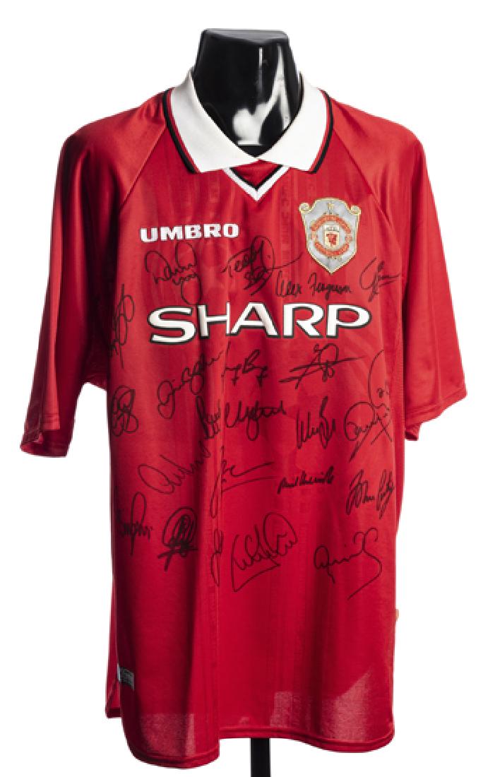 A pair of team-signed Manchester United Champions (1 of 2)