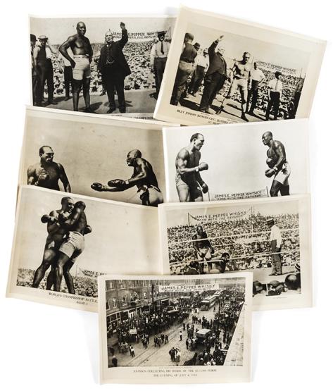 BOXING: A fine group of seven photographs of the famous Jack Johnson v Jim Jeffries Heavweight Championship boxing bout at Reno, Nevada, 4th July 1910, subjects comprise introduction of the fighters in the ri
