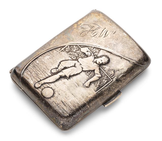 FOOTBALL (SOCCER): An Edwardian silver cigarette case embossed with a footballer, hallmarked Birmingham 1907 by William Harrison Walter, the hinged case embossed with a footballer and initialled HW, weight: 52.4 gms, 8.