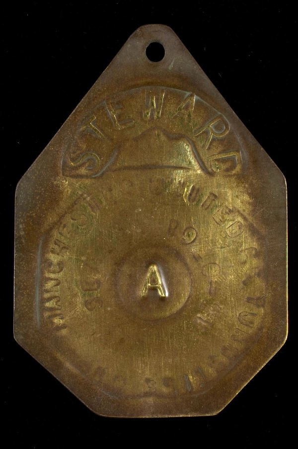 A metal Manchester United steward's badge season 1