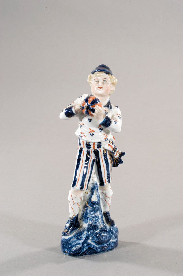 A German bisque figure of a young footballer late