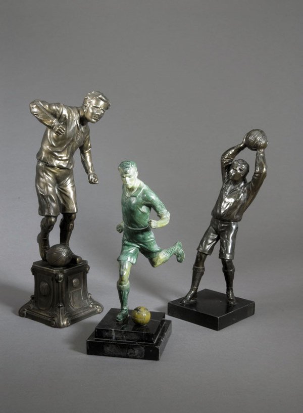 A good group of three spelter footballer figures,