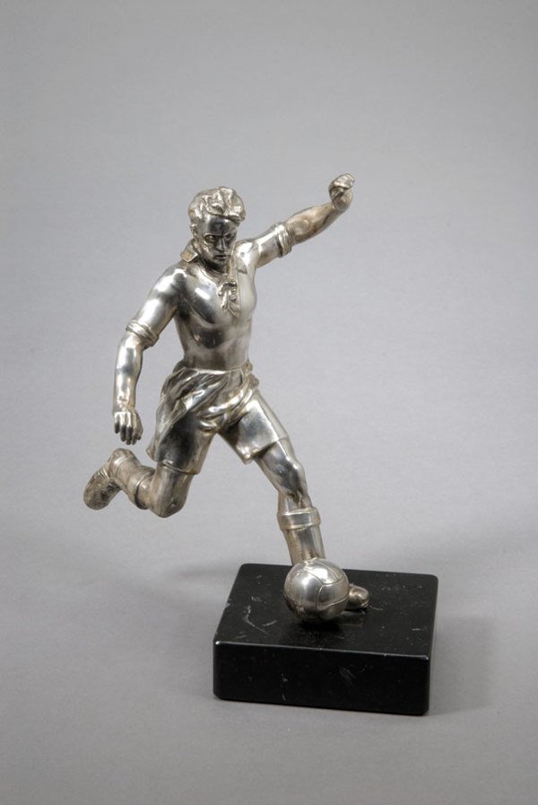 A chromium-plated figure of a footballer, modelled
