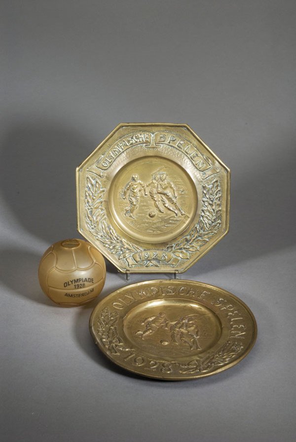 Two brass plates featuring football at the Amsterd