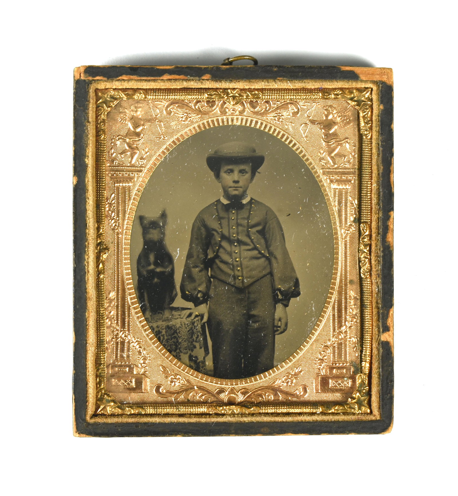 Vintage 1860's Ambrotype of Boy with Dog: Excellent clarity on this Ambrotype vintage 1860's Ambrotype of a yougn boy with a small dog. Gold paint has been added to highlight the buttons on his vest and jacket. 3.25x3.75"